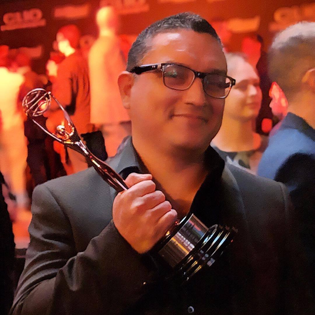 Jay Hernandez holding a Clio award at the Clio Entertainment Awards
